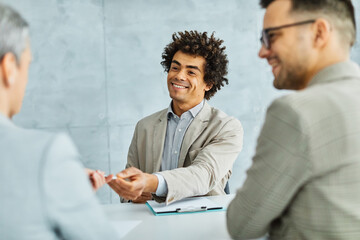 young business people meeting office handshake hand shake shaking hands teamwork group contract agreement black happy smiling success corporate senior applause applauding