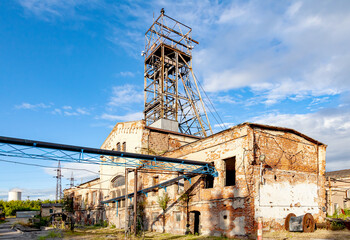 
Old coal mine tower and cloudy sky - 656956146