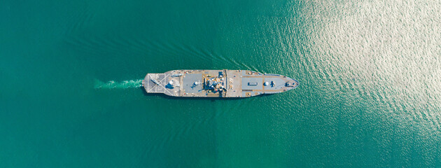 Amphibious Assault Ship. Navy aircraft carrier Aerial top view of battleship, Military sea transport, Military Navy Rescue Helicopter on board the battleship deck - obrazy, fototapety, plakaty