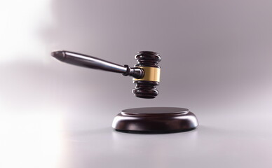 Wooden gavel for court or auction on gray background.Symbol of power and the right to perform competent actions in position of judge