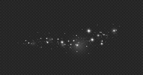 Dust sparks and stars shine with a special light. Christmas light effect. Glittering particles of magic dust.Vector sparkles on a transparent background.