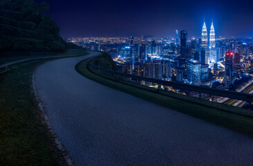 Naklejka premium Aerial view of Kuala Lumpur skyline at night, Malaysia, Asia. Night Scene. Logo removed.