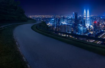 Poster Aerial view of Kuala Lumpur skyline at night, Malaysia, Asia. Night Scene. Logo removed. © LAYHONG