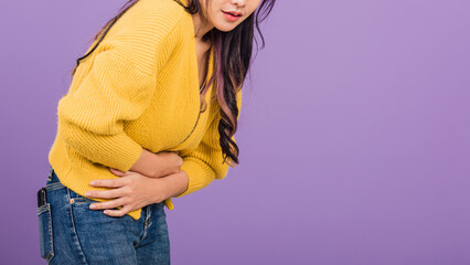 Portrait of Asian beautiful young woman has stomachache, female abdominal pain suffering from...