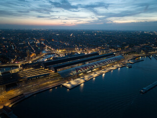 Aerial drone view of the skyline of Amsterdam central station. The Netehrlands.