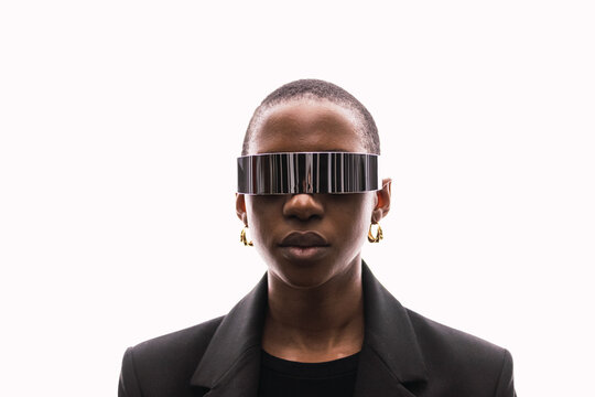 Young woman with smart glasses against white background