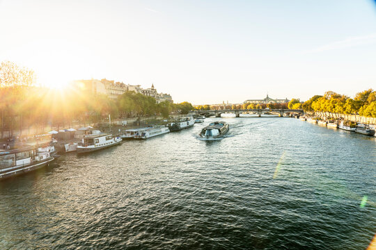 France, Ile-De-France, Paris, Ferry on Seine river at sunset
