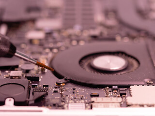 Laptop repair, electronics diagnostics, integrated circuits, chips and electronics, open laptop in the service center