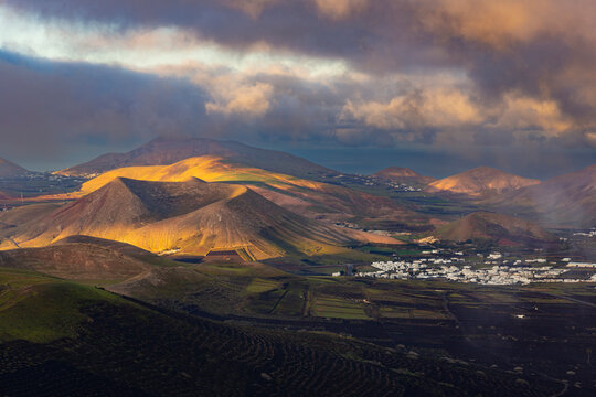 Spain, Canary Islands, La Geria, View from Montana de Guardilama volcano at cloudy dawn