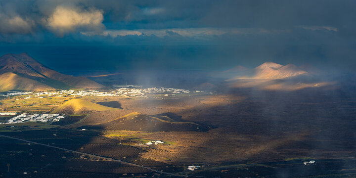Spain, Canary Islands, La Geria, View from MontanadeGuardilamavolcano at cloudy dawn