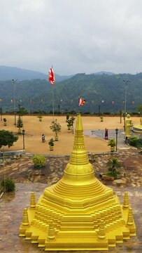 Aerial view of Golden temple Nelligala International Buddhist Center in Sri Lanka. Vertical video.