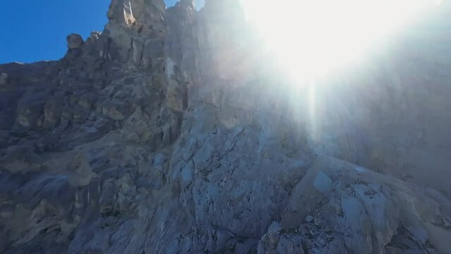 Dramatic FPV Drone Flight over Rocky Mountain Dolomite Peaks in Italy