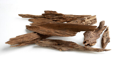 Sticks of agar wood or agarwood isolated on white background. (Oud) - obrazy, fototapety, plakaty
