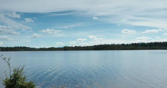 Kirchsee, bog lake near Sachsenkam in Upper Bavaria with view to the South bank, nature reserve Ellbach- und Kirchseemoor and the Kloster Reutberg monastery 