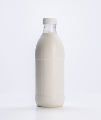 fresh milk in plastic bottle on white background