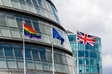 The pride flag, EU flag, and Union Jack flag