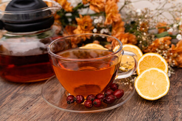 A cup of tea with rosehip and lemons. Healthy lifestyle. Folk methods