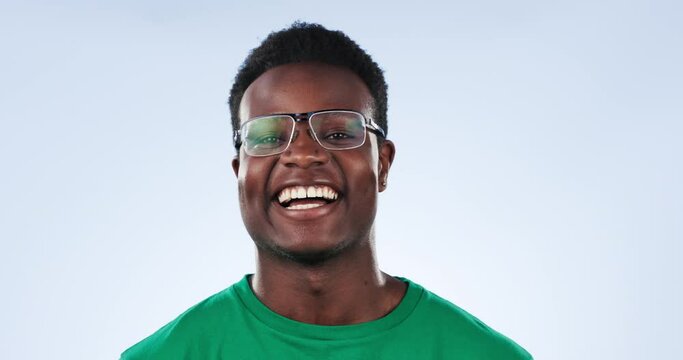Volunteer, glasses and happy black man for charity outreach project, studio pollution support or community service foundation. Eyeglasses, climate change help or NGO model portrait on blue background