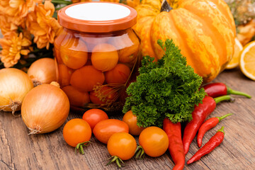 Canned cherry tomatoes. Vegetables for preservation on the table in the kitchen
