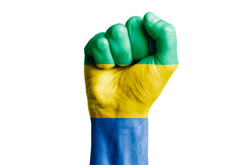 Man hand fist of GABON flag painted. Close-up.