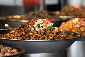 Spicy flavored snail meat, delicious street food in Taiwan.