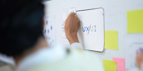 Close up ux developer and ui designer use augmented reality brainstorming about mobile app...