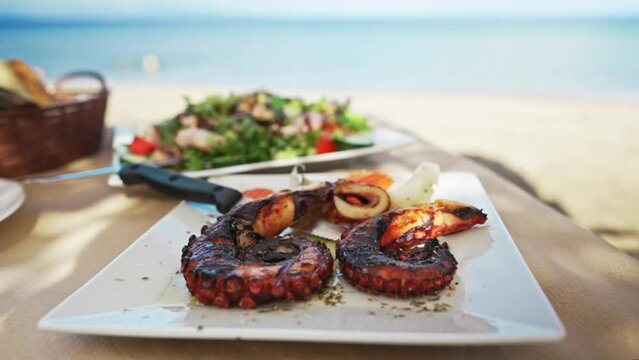 Grilled octopus tentacles seasoned with wine sauce.