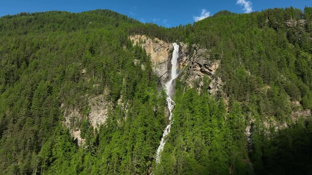 Lehner Wasserfall waterfall in the Otztal valley in Tyrol Austria during a beautiful springtime day in the Alps.