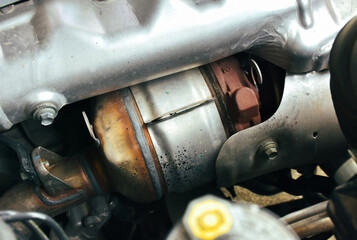Catalytic converter on diesel engine in a car, close up a car catalytic converter for filtration...