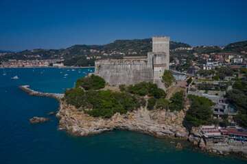 Obraz premium Vivid beautiful town Lerici in Liguria, Italy. Italian resorts on the Ligurian coast aerial view. Yachts and boats. Aerial view of Lerici Castle.
