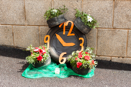 Clock made with car tires and flowers on "Costitx en Flor" (Costitx in bloom) Flower Fair, Majorca, Spain