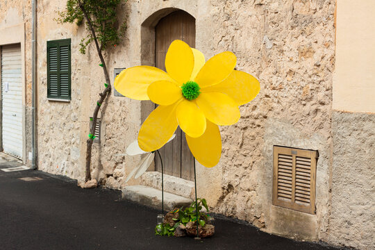 Big yellow textil flower decorations on "Costitx en Flor" (Costitx in bloom) Flower Fair, Majorca, Spain