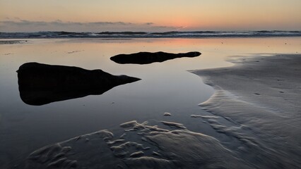 Southern California beach scenes with sunsets, surfers, tide pools and palms trees at Swamis Reef...