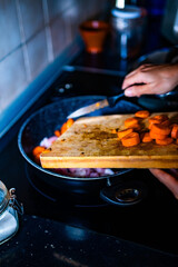 someone is cooking in the kitchen.