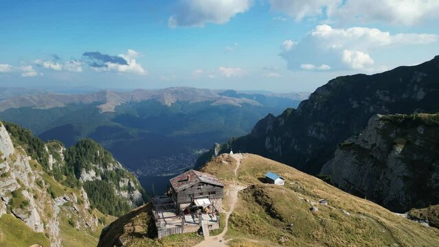 View on Caraiman chalet in Bucegi mountains,Romania. Mountain chalet.  Caraiman Cabin and beautiful mountains landscape .