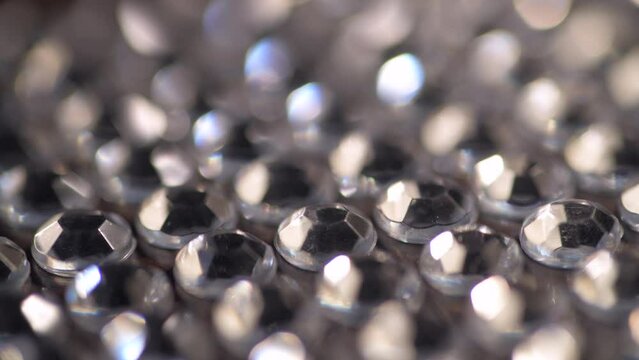 Plastic diamonds are illuminated by the light.	
