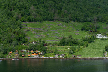 Beautiful landscape with houses in Geiranger fjord, Norway - 657081727