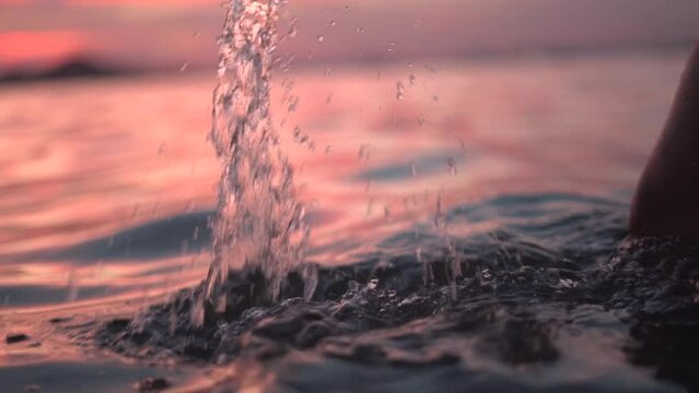Serene sunset bath for expecting mother at the beach