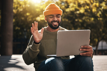 Student, laptop and video call outdoor for university, college and online education, e learning or scholarship interview on campus. African man with computer, waves hello and virtual class in a park