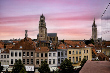 Fototapeta premium BRUGES, BELGIUM amazing historic city that enchants tourists visitors with its picturesque canals historic medieval architecture towers and medieval charmand tour The Bruges horsecar 