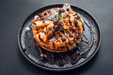 Waffels with banana slices and Chocolate syrup