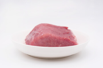 A piece of lean pork on a plate