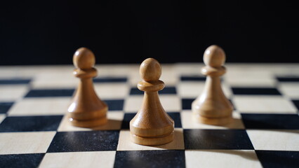 Three pawns on a chessboard