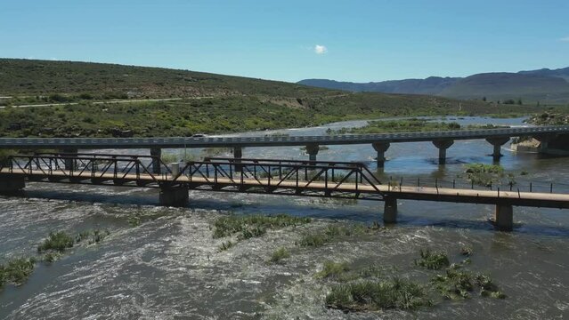 New and old bridges cross the Olifants river near Clanwilliam - aerial jib up