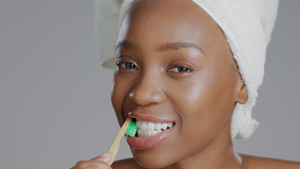 Portrait, black woman with toothbrush for teeth whitening and dental, health and wellness isolated...