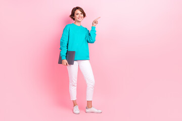 Full length photo of young lady finger empty space apple macbook samsung dressed stylish blue garment isolated on pink color background