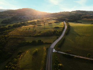 Drone view of an typical Italian hills at dawn, the sun rises against the backdrop of the Italian...