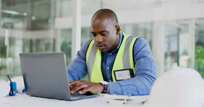 Man, engineering and laptop for online planning, blueprint report and design update in office project management. African builder, contractor or architecture worker typing on computer for floor plan
