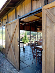 Barnyard rustic wooden door, sliding vintage door with rustic oak wood, café barn.