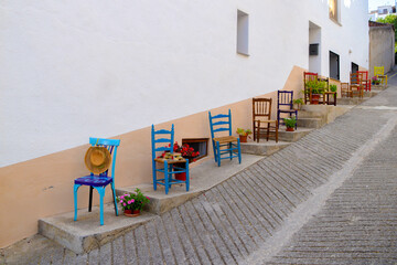 street full of chairs in a medieval town